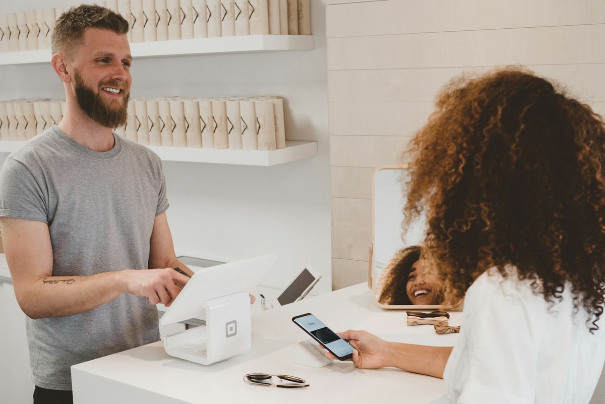A customer paying at a card terminal